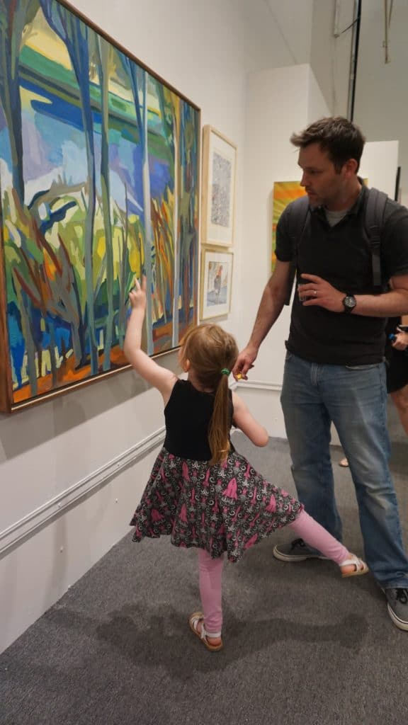 little girl at an opening reception at The Art League Gallery
