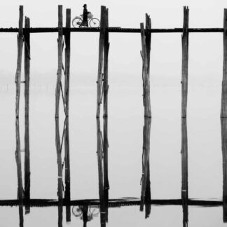 Woman with Bike on Bridge, Burma by Wayne Guenther