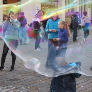 Giant Bubbles at a Berlin Street Scene by Helga Kelter